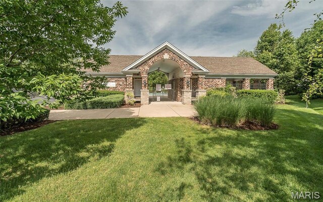 102 Carlton Point Dr, Wentzville, MO 63385 - view of front of house with brick siding, a front lawn, and roof with shingles