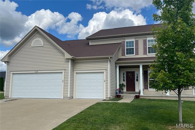 102 Carlton Point Dr, Wentzville, MO 63385 - view of front facade featuring driveway, a front lawn, and an attached garage