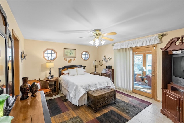 tiled bedroom featuring access to outside and ceiling fan