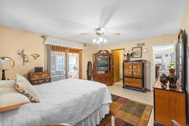bedroom with ceiling fan and light tile patterned floors