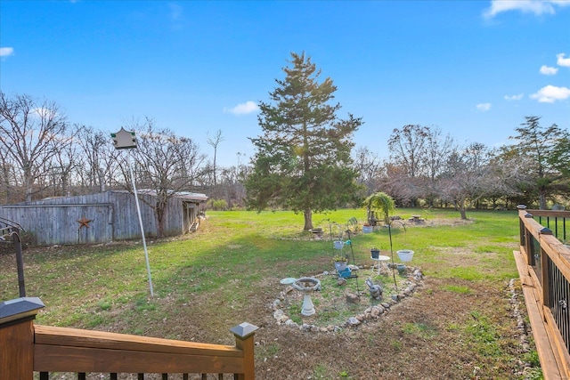 view of green lawn featuring an outdoor structure