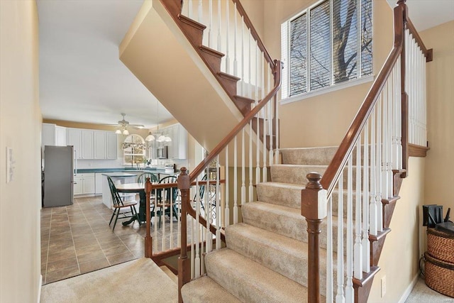 775 Vista Glen Ct, Eureka, MO 63025 - stairway featuring ceiling fan and carpet