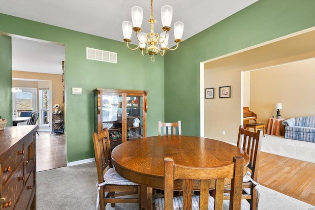 775 Vista Glen Ct, Eureka, MO 63025 - dining area featuring carpet flooring, a chandelier, and baseboards
