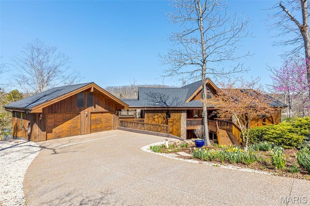 2208 N Konstanz Dr, Innsbrook, MO 63390 - view of front facade featuring stairway, a porch, asphalt driveway, and roof with shingles