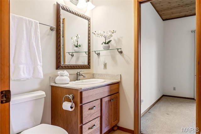 2208 N Konstanz Dr, Innsbrook, MO 63390 - bathroom featuring toilet, vanity, wood ceiling, and baseboards