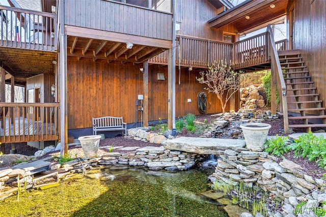 2208 N Konstanz Dr, Innsbrook, MO 63390 - view of yard with stairway, a garden pond, and a wooden deck