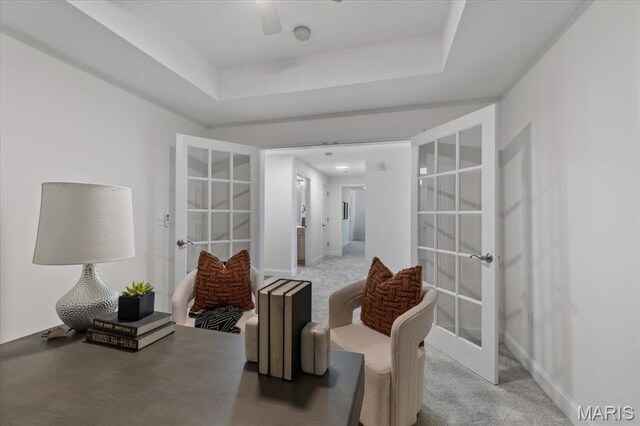 842 N New Ballas Ct Unit 303, Saint Louis, MO 63141 - living area with french doors, carpet floors, a raised ceiling, ceiling fan, and baseboards