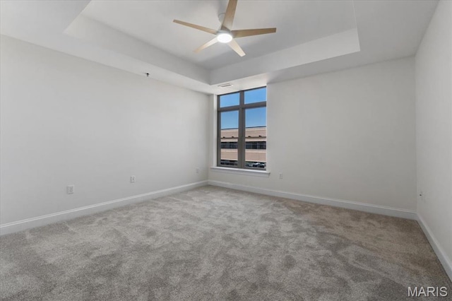 842 N New Ballas Ct Unit 303, Saint Louis, MO 63141 - carpeted empty room featuring a tray ceiling, ceiling fan, and baseboards