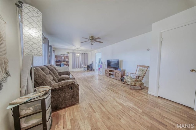 611 N Charles Ave, St James, MO 65559 - living room featuring wood finished floors and a ceiling fan