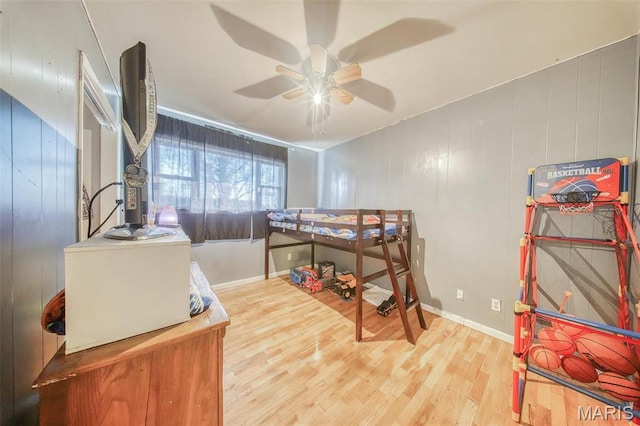 611 N Charles Ave, St James, MO 65559 - bedroom featuring wood finished floors, baseboards, and a ceiling fan