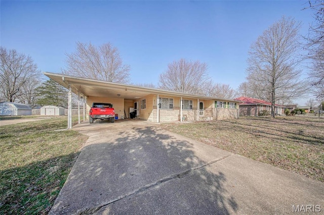 611 N Charles Ave, St James, MO 65559 - single story home with concrete driveway, a porch, a front yard, a carport, and stone siding