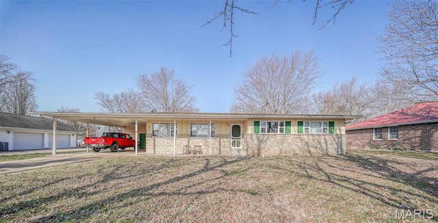 611 N Charles Ave, St James, MO 65559 - single story home with an attached carport, concrete driveway, and a front lawn