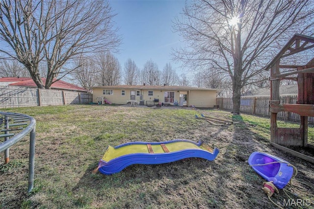 611 N Charles Ave, St James, MO 65559 - rear view of house with a fenced backyard