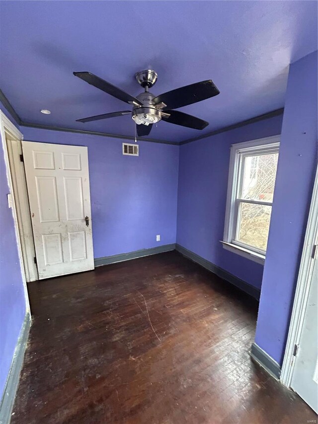3804 Melba Pl, Saint Louis, MO 63121 - unfurnished bedroom featuring baseboards, dark wood-style flooring, and ceiling fan