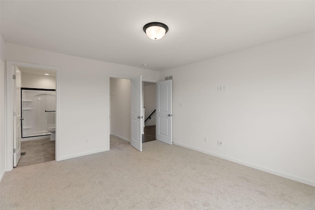 1028 Red Fox Dr, Eureka, MO 63025 - unfurnished bedroom with carpet floors, baseboards, a walk in closet, ensuite bathroom, and a closet