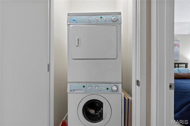 laundry room with estacked washer and dryer