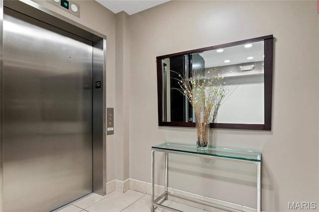 9 N Euclid Ave Unit 508, Saint Louis, MO 63108 - bathroom featuring elevator, tile patterned floors, and baseboards