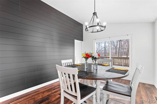 19120 Hawk Mountain Rd, Wildwood, MO 63038 - dining space featuring a chandelier, wood finished floors, vaulted ceiling, and baseboards