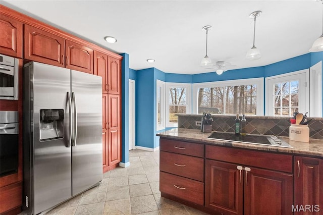 19120 Hawk Mountain Rd, Wildwood, MO 63038 - kitchen featuring appliances with stainless steel finishes, tasteful backsplash, hanging light fixtures, and healthy amount of natural light