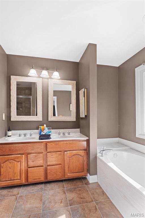 19120 Hawk Mountain Rd, Wildwood, MO 63038 - bathroom with a garden tub, double vanity, tile patterned floors, and baseboards