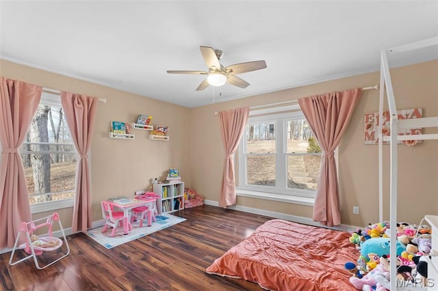 19120 Hawk Mountain Rd, Wildwood, MO 63038 - bedroom with multiple windows, wood finished floors, baseboards, and a ceiling fan