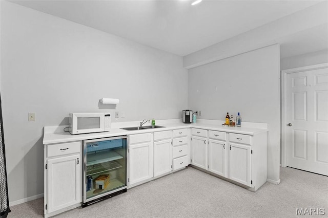 19120 Hawk Mountain Rd, Wildwood, MO 63038 - bar area with wine cooler, white microwave, a sink, and baseboards