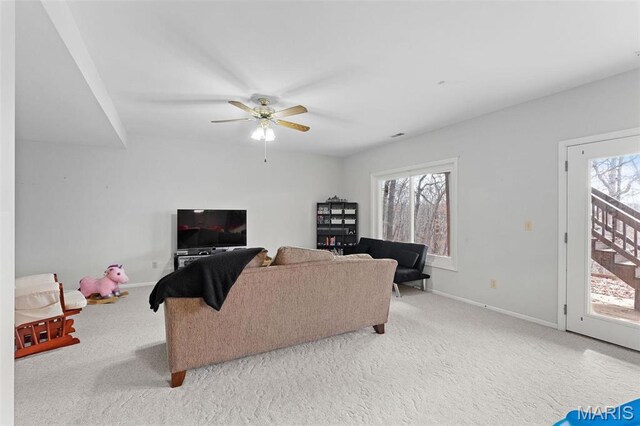 19120 Hawk Mountain Rd, Wildwood, MO 63038 - carpeted living area featuring healthy amount of natural light, a ceiling fan, and baseboards