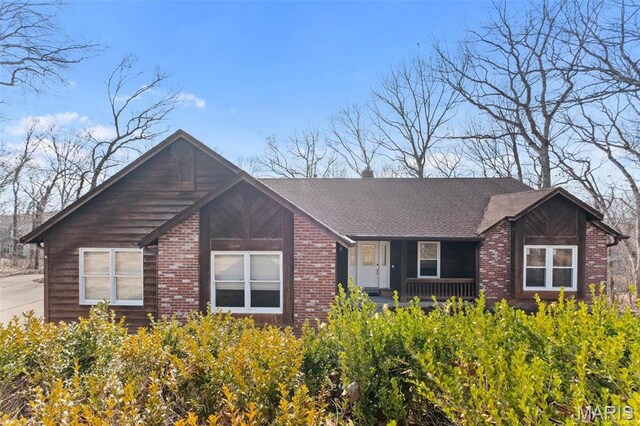 19120 Hawk Mountain Rd, Wildwood, MO 63038 - view of front facade featuring brick siding and a porch