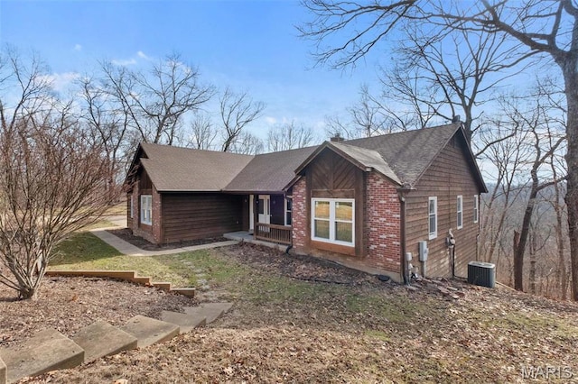 19120 Hawk Mountain Rd, Wildwood, MO 63038 - view of front of home featuring covered porch, cooling unit, and roof with shingles