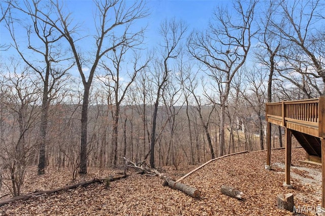 19120 Hawk Mountain Rd, Wildwood, MO 63038 - view of yard featuring a wooden deck and a wooded view