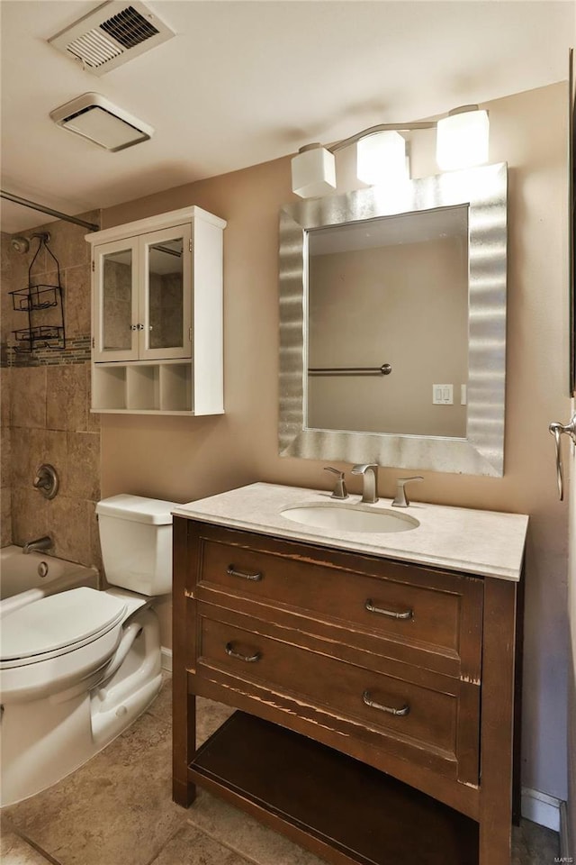 1626 High School Dr, Saint Louis, MO 63144 - full bath featuring vanity, toilet, shower / bath combination, tile patterned flooring, and baseboards