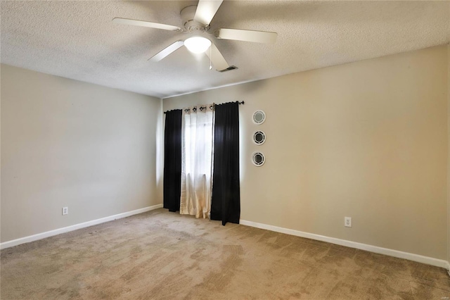 1626 High School Dr, Saint Louis, MO 63144 - unfurnished room featuring light colored carpet, ceiling fan, a textured ceiling, and baseboards