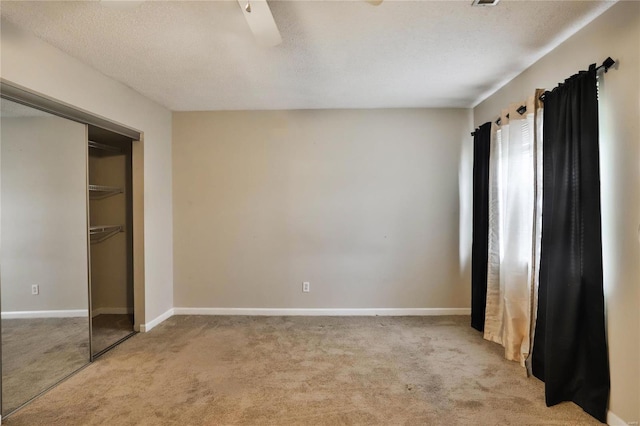 1626 High School Dr, Saint Louis, MO 63144 - unfurnished bedroom with carpet, a closet, baseboards, and a textured ceiling