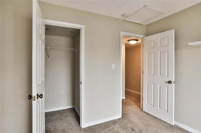 1626 High School Dr, Saint Louis, MO 63144 - unfurnished bedroom with attic access, carpet, a closet, and baseboards