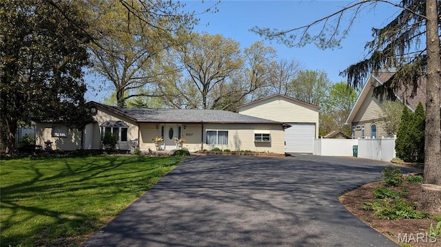view of front of home with driveway and an attached garage