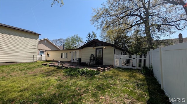 back of house with a patio area and a gate
