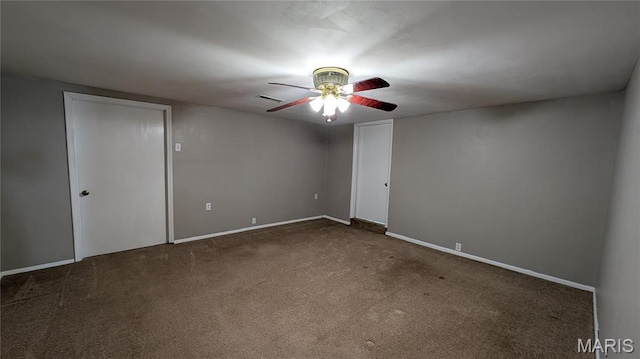 unfurnished room with a ceiling fan, carpet floors, and baseboards