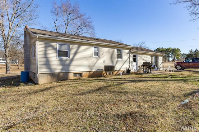 4279 Ee Hwy, Farmington, MO 63640 - back of house featuring a lawn and cooling unit