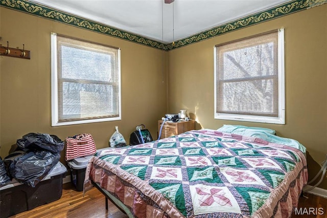 4279 Ee Hwy, Farmington, MO 63640 - bedroom with multiple windows and wood finished floors