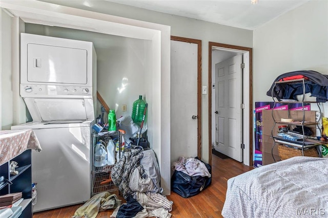 4279 Ee Hwy, Farmington, MO 63640 - washroom with stacked washing machine and dryer and wood finished floors
