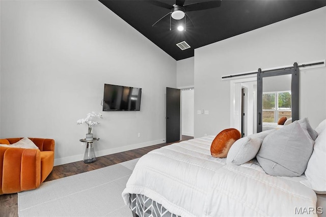 3545 Cappeln Osage Rd, Marthasville, MO 63357 - bedroom with a barn door, high vaulted ceiling, wood finished floors, baseboards, and ceiling fan