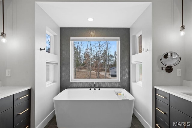 3545 Cappeln Osage Rd, Marthasville, MO 63357 - bathroom featuring vanity, baseboards, a soaking tub, and recessed lighting