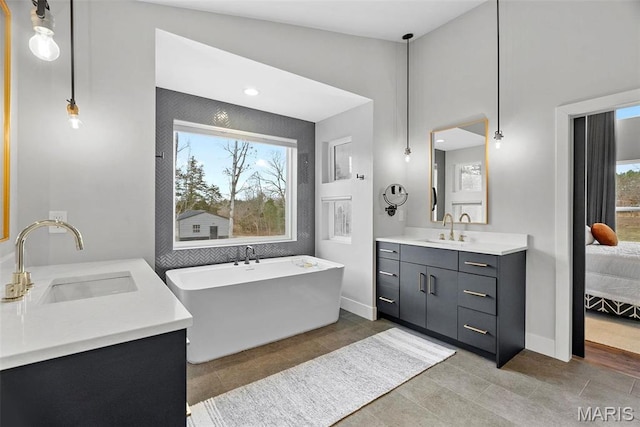 3545 Cappeln Osage Rd, Marthasville, MO 63357 - full bathroom featuring vanity, a freestanding tub, baseboards, and tile patterned flooring