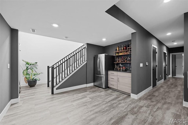 3545 Cappeln Osage Rd, Marthasville, MO 63357 - indoor dry bar with freestanding refrigerator, baseboards, stairs, recessed lighting, and light wood finished floors