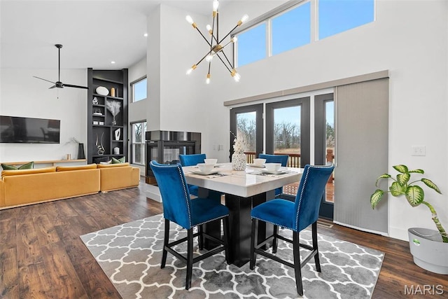 3545 Cappeln Osage Rd, Marthasville, MO 63357 - dining room featuring wood finished floors, a ceiling fan, a chandelier, a high ceiling, and recessed lighting