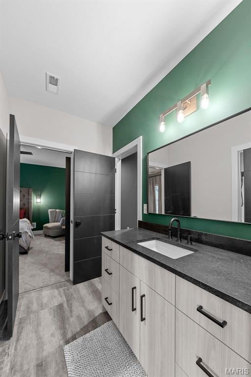 3545 Cappeln Osage Rd, Marthasville, MO 63357 - bathroom with wood finished floors, connected bathroom, and vanity