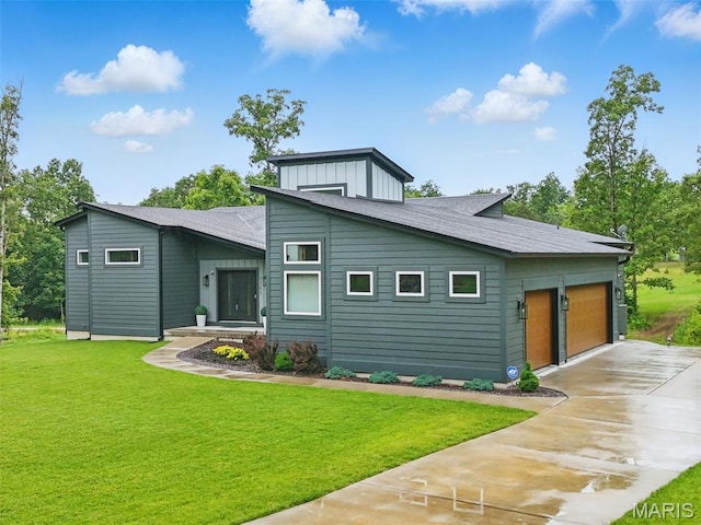 3545 Cappeln Osage Rd, Marthasville, MO 63357 - view of front of house with concrete driveway, a front lawn, and an attached garage