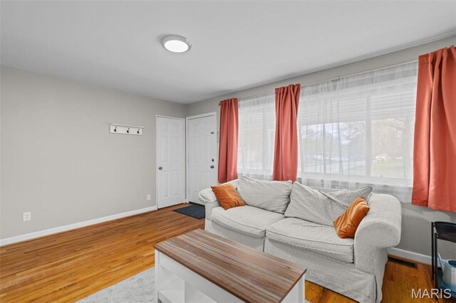 190 Coteau Ln, Florissant, MO 63033 - living room with baseboards and wood finished floors