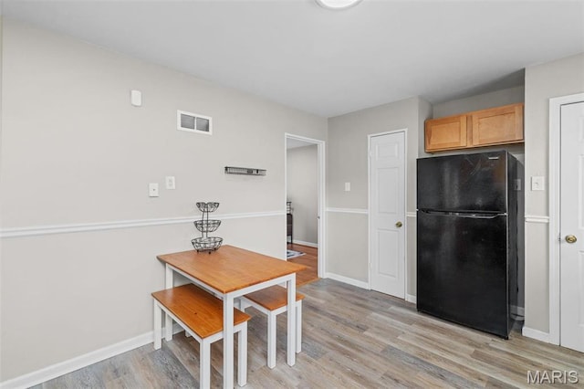 190 Coteau Ln, Florissant, MO 63033 - dining room featuring light wood finished floors and baseboards