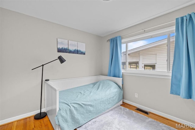 190 Coteau Ln, Florissant, MO 63033 - bedroom with baseboards and wood finished floors